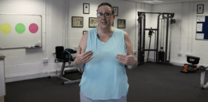 A woman in a blue T-shirt smiling