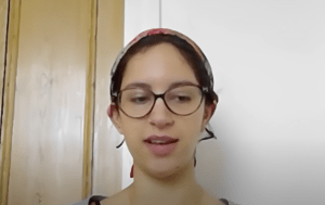 A young woman wearing a bandana