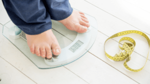 A woman standing on a set of scales