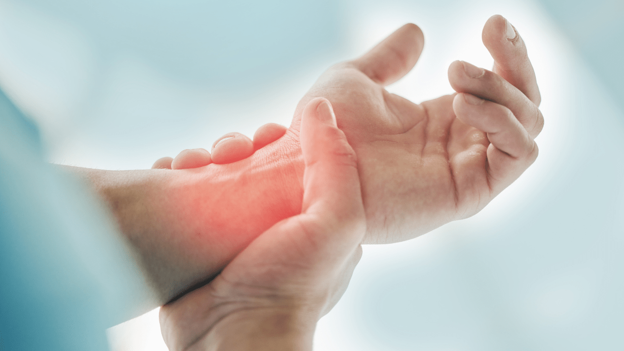 A woman holding a painful wrist